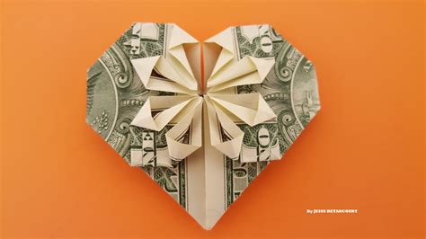 Fold money into a heart - Fold each corner down at a 45-degree angle to touch the horizontal creased section of the back side of the dollar bill. Press flat to crease the fold and secure these tiny triangle flaps in place. Turn the bill over to see your folded paper money heart. Use a few simple folds to turn paper money into a heart. 